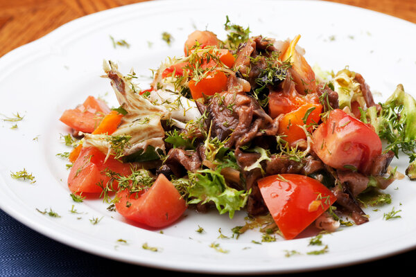 Tofu marinated in soy sauce with tomato and salad