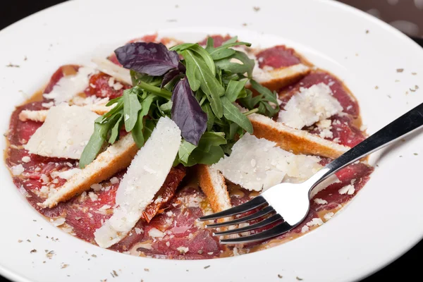 Beef Carpaccio with shaved parmesan cheese — Stock Photo, Image