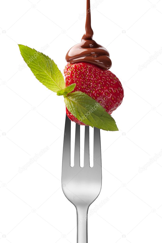 Strawberry with chocolate and mint on the fork