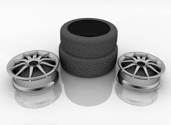 Neumáticos de coche de diferentes tamaños con una llanta en un blanco —  Fotos de Stock