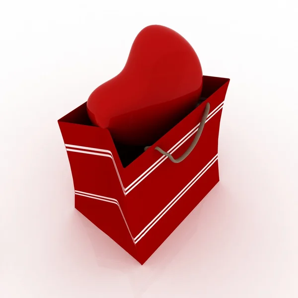 Corazón en bolsa para regalo sobre fondo blanco — Foto de Stock