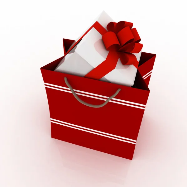 Geschenkdoos met rode strik in zak voor gift op wit — Stockfoto