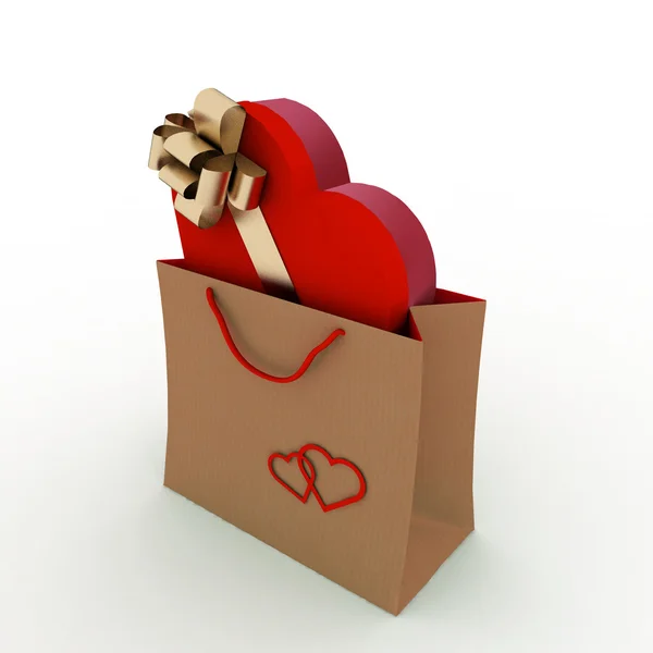Schachtel als Herzform mit Goldschleife im Beutel als Geschenk — Stockfoto