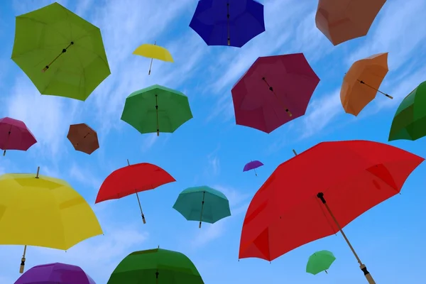 Flying of multicoloured umbrellas — Stock Photo, Image