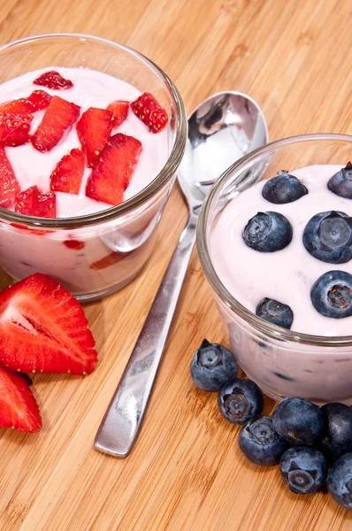 Mixed Yoghurts on wooden background — Stock Photo, Image