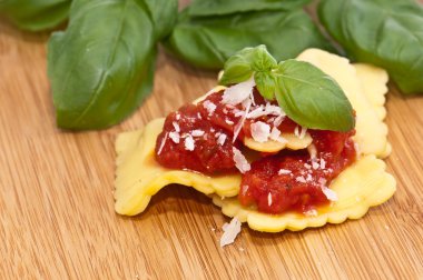 Some Raviolis with tomato sauce clipart