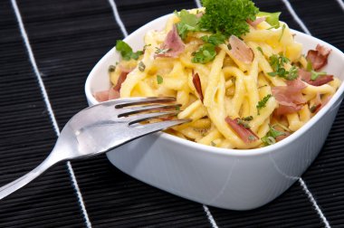 Cheese Spaetzle in a Bowl (on black) clipart
