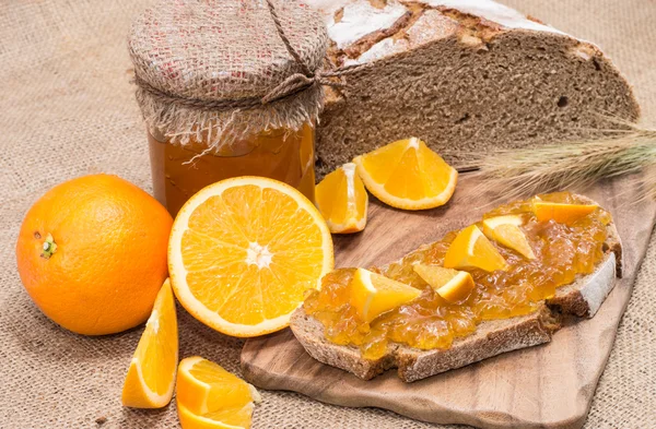 Bread with Orange Jam (rustic background)