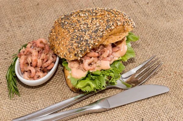 stock image Shrimps on a roll against rustic background