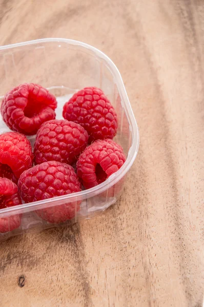 stock image Raspberries on wooden background