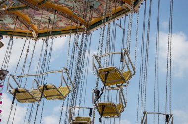 Chairoplane with clouds clipart