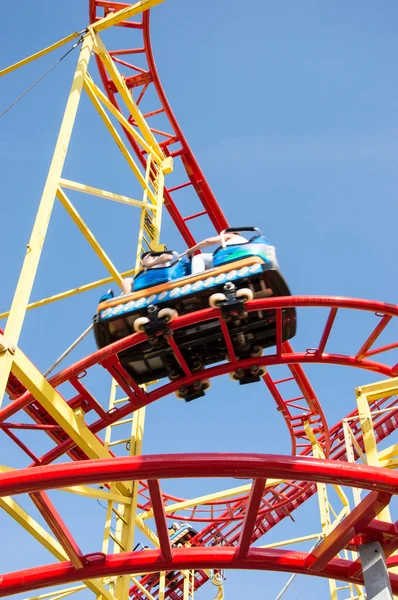 Small Rollercoaster on blue sky — Stock Photo, Image
