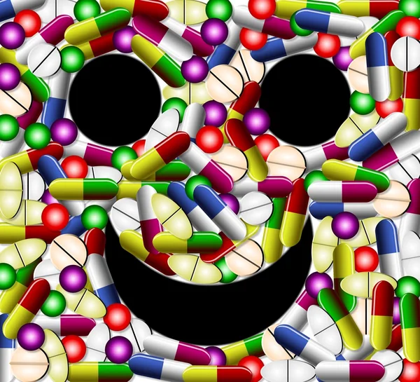 Усміхнене обличчя з таблетки — стокове фото