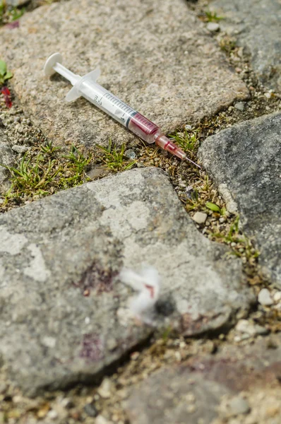 stock image Syringe just used by a drug addict