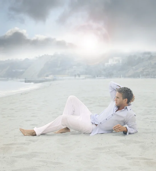 stock image Man laying on beach