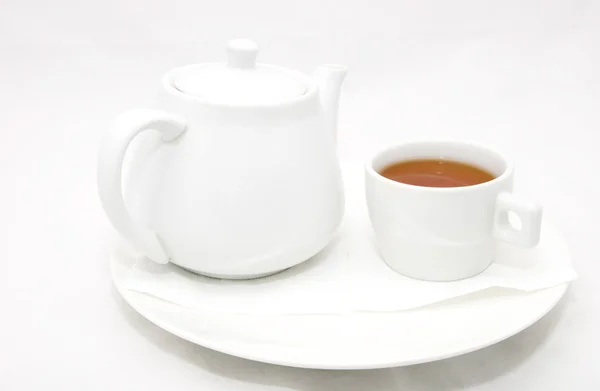 Kettle with tea and a mug — Stock Photo, Image