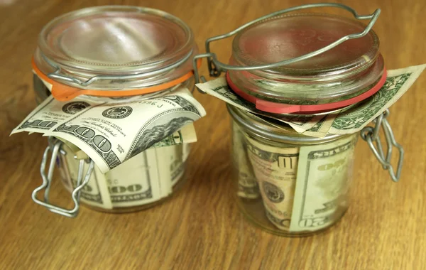Glass jars with money — Stock Photo, Image