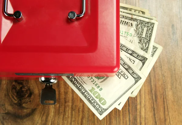 Money and a box for storage — Stock Photo, Image