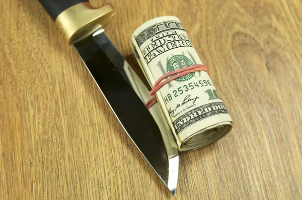 Dollars and knife — Stock Photo, Image