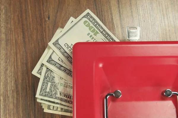 Money and a box for storage — Stock Photo, Image