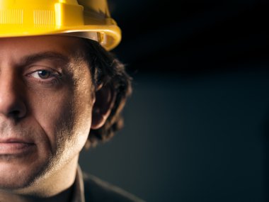 Portrait of adult manual worker with helmet clipart