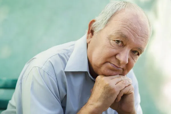 Portrait of sad bald senior man looking at camera — Stock Photo, Image