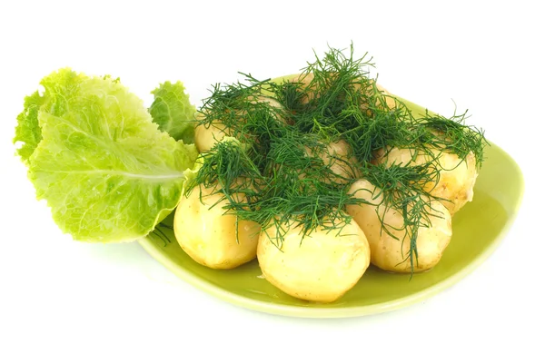 Молодой вареный картофель с салатом и укропом — стоковое фото