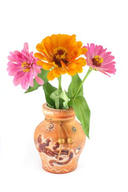 Zinnia flowers in a clay vase clipart