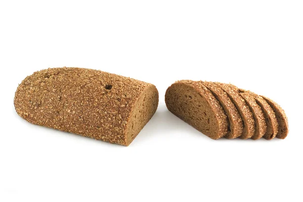 Se corta una barra de pan de salvado —  Fotos de Stock