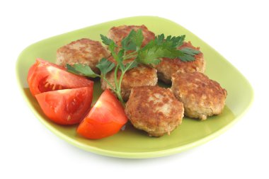 Fried meatballs with parsley and tomatoes clipart