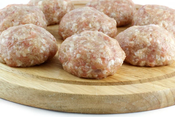 Balls of minced meat on a kitchen board — Stock Photo, Image