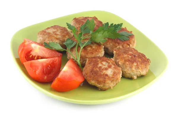 stock image Fried meatballs with parsley and tomatoes