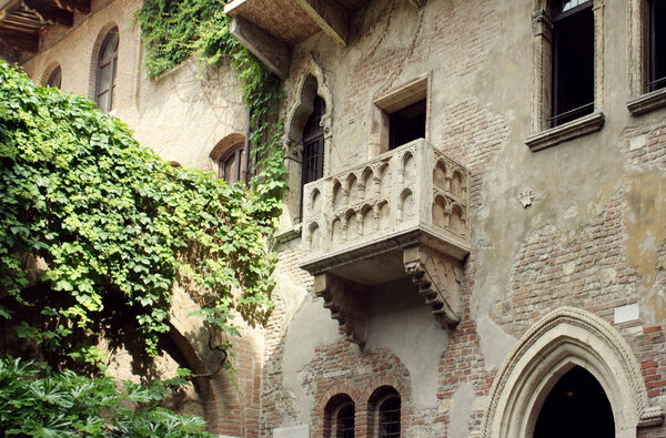 The famous antique facade of the building with the balcony of Juliet Capulet in Verona, Italy