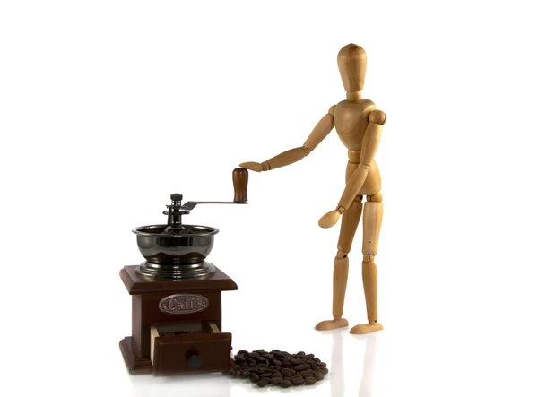 Mann aus Holz mahlt Kaffee auf einer alten Maschine — Stockfoto