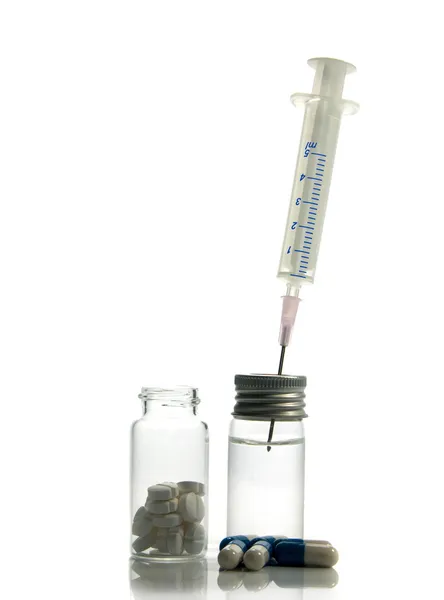 Medical needle in bottle with medicine — Stock Photo, Image