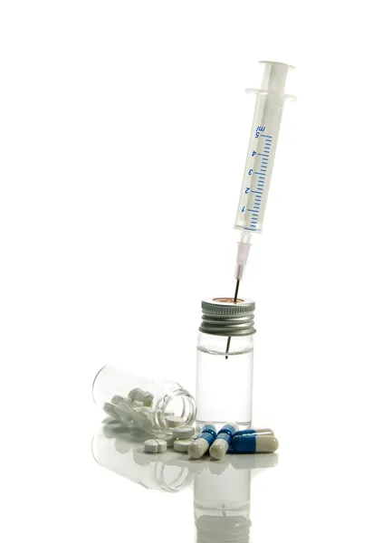 Medical needle in bottle and medicine — Stock Photo, Image