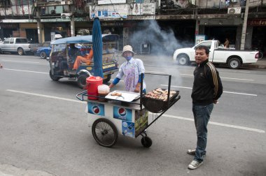 Smoking food in bangkok clipart