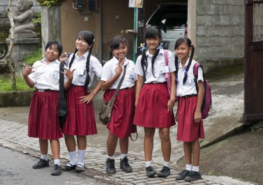 Girls in Ubud in school uniform clipart