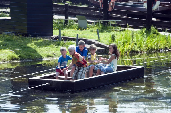 Children playing with boat — Stock Photo, Image
