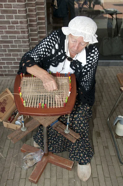 Old woman handicraft — Stock Photo, Image
