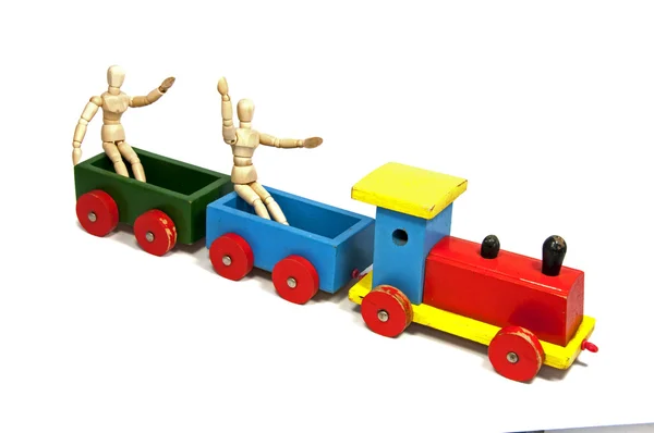 Dvě dřevěné panenky sedí ve vlaku — Stock fotografie