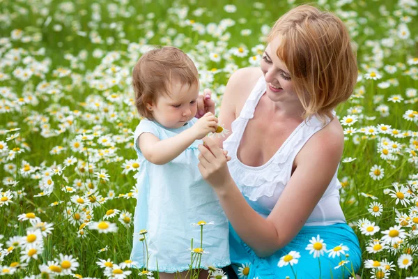 Mother with daughter on the meadow — Stock Photo, Image