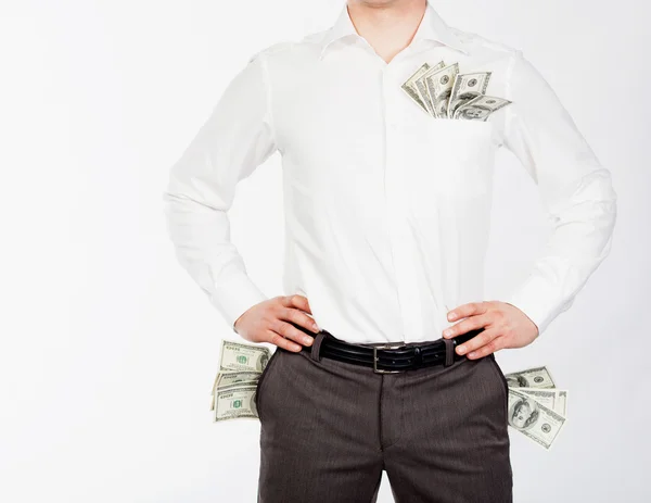 Mannen met dollars in zakken — Stockfoto