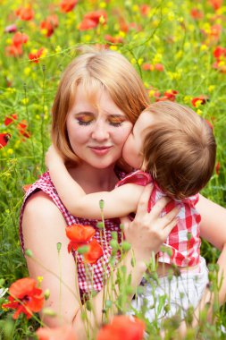 Family on the poppy field