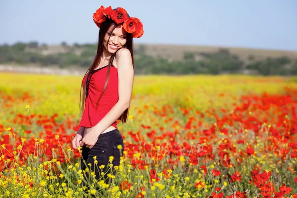 Girl on the poppy meadow — Stock Photo, Image