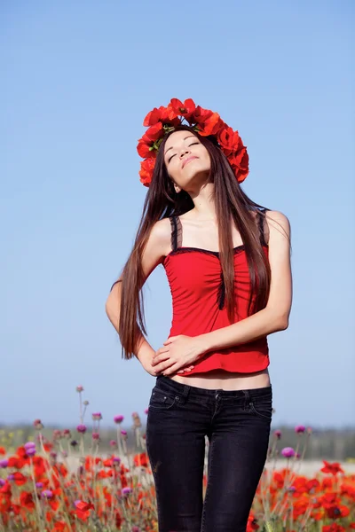 Girl on the poppy meadow — Stok fotoğraf