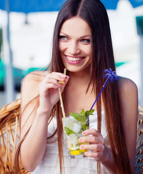 Girl with cocktail in cafe — Stock Photo, Image