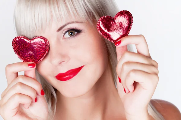 Chica rubia con corazones —  Fotos de Stock