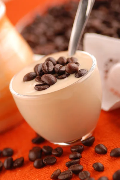 Yoghurt with coffee beans — Stock Photo, Image