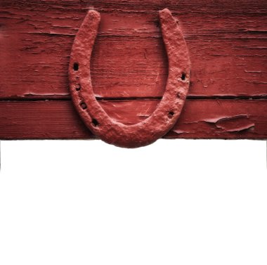 The old horseshoe hanging on wooden wall clipart